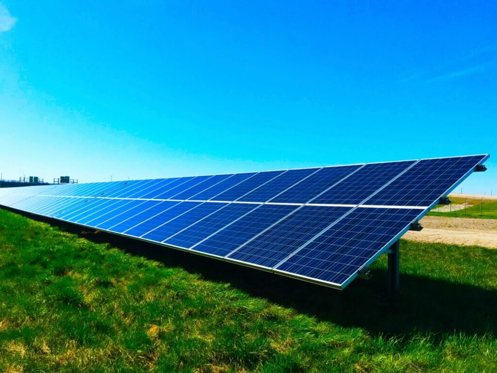 Solar panels under an oversaturated blue sky