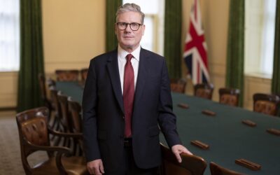 UK prime minister Kier Starmer stands in a conference room facing the camera