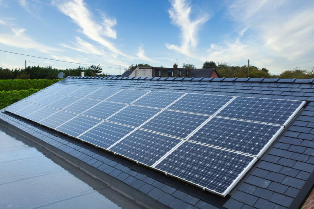 Solar panels on a roof under a blue sky