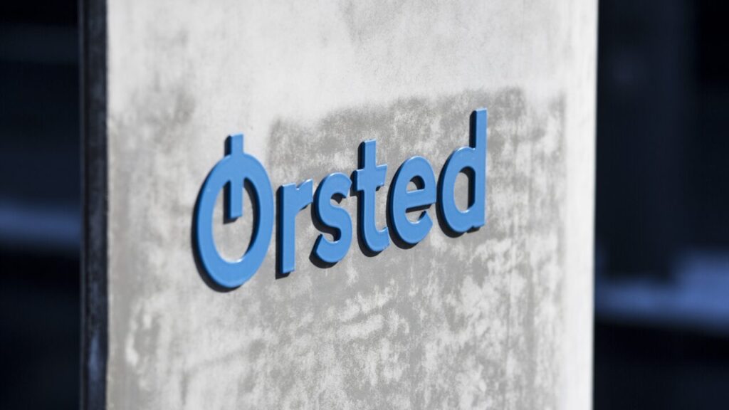 a closeup of the orsted sign, made of concrete