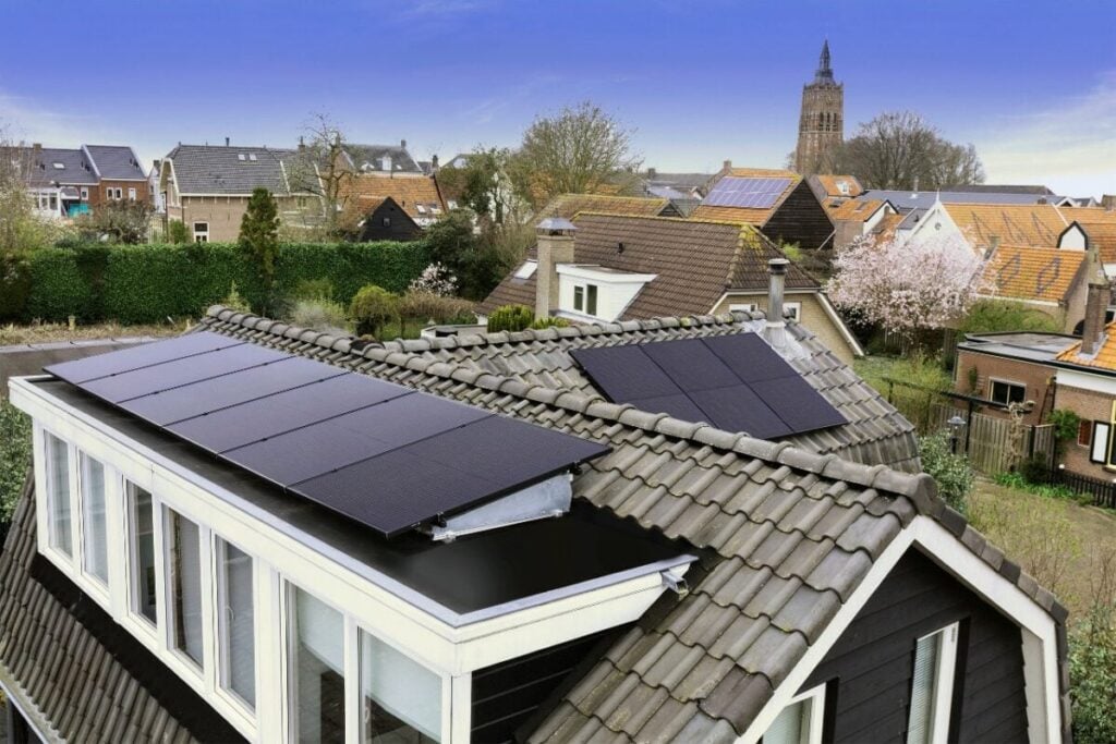 Residential rooftops with solar panels installed.